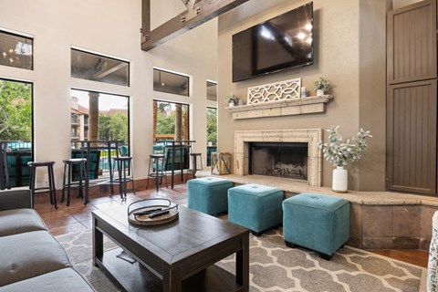 a living room with a fireplace and a television